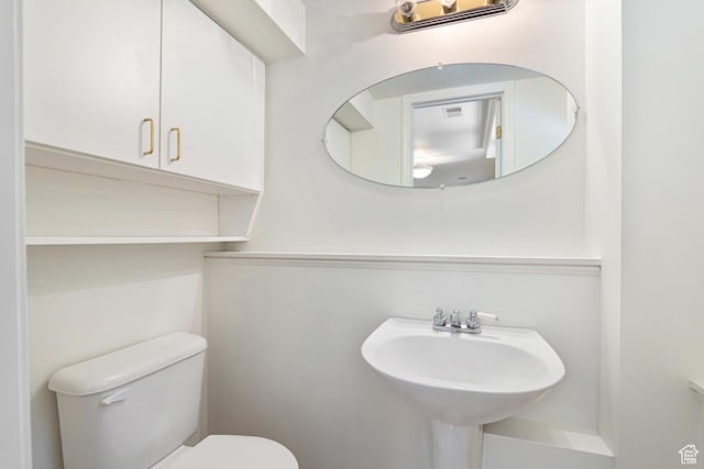 4115 Edgehill Dr, Ogden, UT 84403 - half bathroom with toilet and a sink