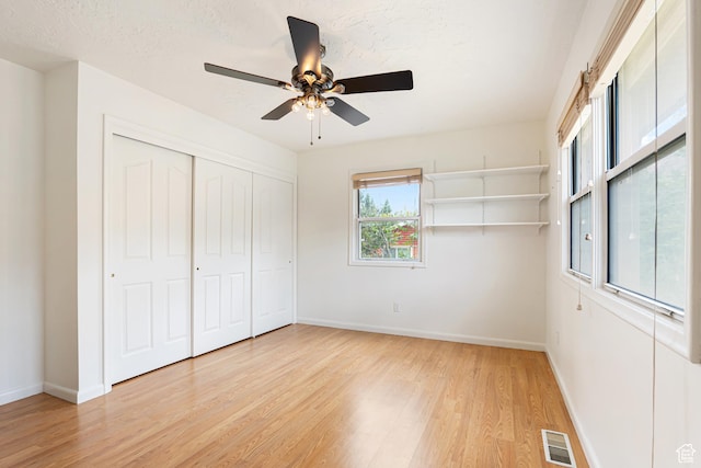 4115 Edgehill Dr, Ogden, UT 84403 - unfurnished bedroom with light wood-style flooring, baseboards, ceiling fan, and a closet