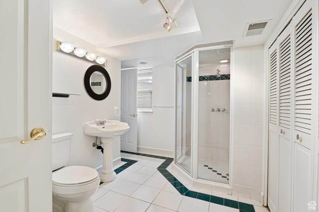4115 Edgehill Dr, Ogden, UT 84403 - full bath with tile patterned flooring, a shower stall, toilet, and baseboards
