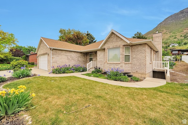 1156 N Cherry Ln E, Provo, UT 84604 - single story home featuring brick siding, a chimney, a front yard, and a garage