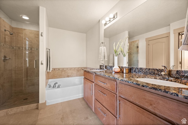 3702 S Arbroath Ln, South Salt Lake, UT 84115 - bathroom featuring a shower stall, a garden tub, tile patterned floors, and double vanity