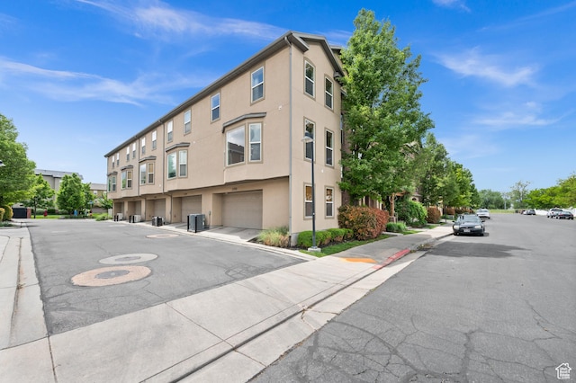 3702 S Arbroath Ln, South Salt Lake, UT 84115 - view of building exterior featuring an attached garage