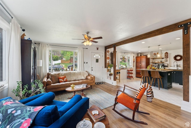 32 S Kingdon Ln E, North Salt Lake, UT 84054 - living area with ceiling fan, light wood-style flooring, beam ceiling, and recessed lighting