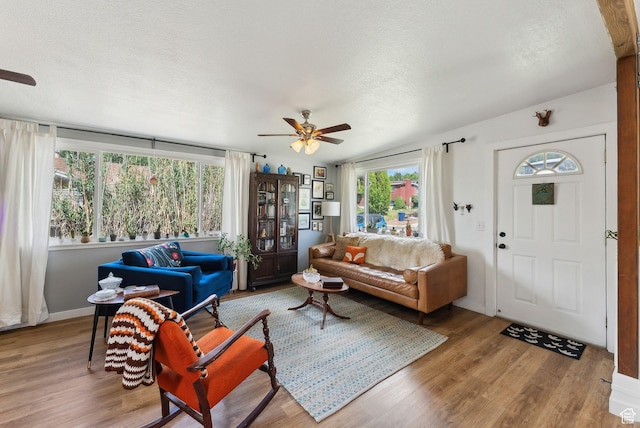 32 S Kingdon Ln E, North Salt Lake, UT 84054 - living area with a ceiling fan, healthy amount of natural light, wood finished floors, and a textured ceiling