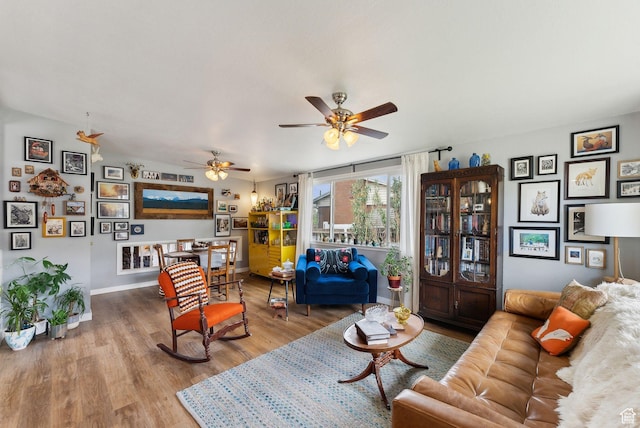 32 S Kingdon Ln E, North Salt Lake, UT 84054 - living room featuring wood finished floors, ceiling fan, and baseboards