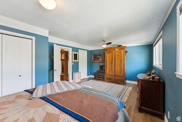32 S Kingdon Ln E, North Salt Lake, UT 84054 - bedroom with wood finished floors, a closet, baseboards, and ceiling fan