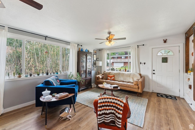 32 S Kingdon Ln E, North Salt Lake, UT 84054 - living room featuring ceiling fan, wood finished floors, and baseboards
