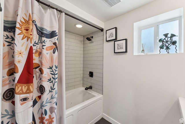 32 S Kingdon Ln E, North Salt Lake, UT 84054 - full bathroom featuring baseboards and shower / bath combo with shower curtain