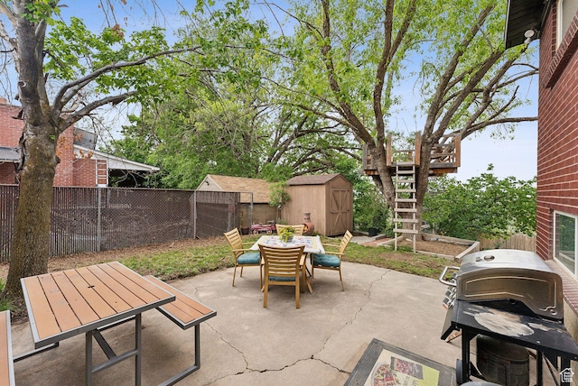 32 S Kingdon Ln E, North Salt Lake, UT 84054 - view of patio / terrace featuring outdoor dining area, a shed, a fenced backyard, an outdoor structure, and stairs