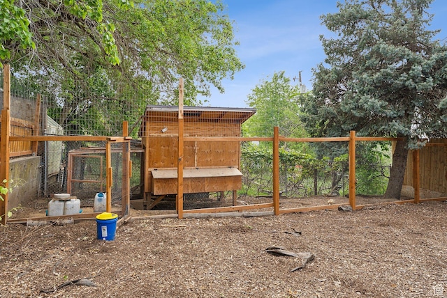 32 S Kingdon Ln E, North Salt Lake, UT 84054 - view of playground with exterior structure, an outbuilding, and fence