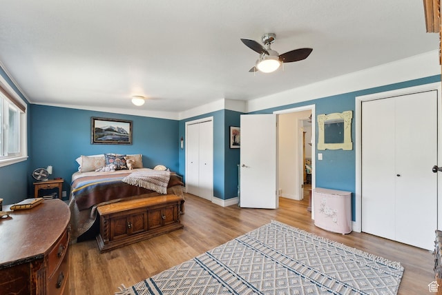 32 S Kingdon Ln E, North Salt Lake, UT 84054 - bedroom featuring wood finished floors, a closet, a ceiling fan, and baseboards