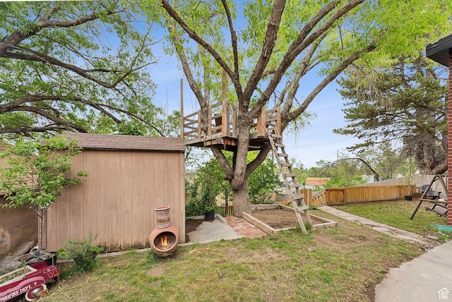 32 S Kingdon Ln E, North Salt Lake, UT 84054 - view of yard featuring a storage shed, an outdoor structure, and a vegetable garden