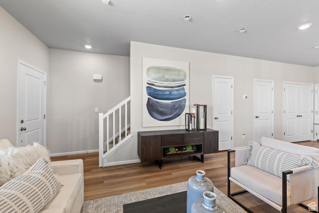 354 N Colonnade Rd Unit 987, Saratoga Springs, UT 84045 - living area with wood finished floors, baseboards, stairway, and recessed lighting