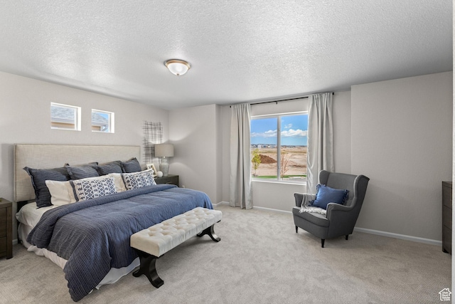 354 N Colonnade Rd Unit 987, Saratoga Springs, UT 84045 - bedroom featuring a textured ceiling, light colored carpet, and baseboards