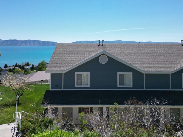 918 N Newberg Dr N Unit 4, Garden City, UT 84028 - rear view of property with a shingled roof and a water and mountain view
