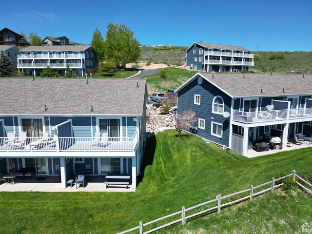 918 N Newberg Dr N Unit 4, Garden City, UT 84028 - rear view of house featuring a patio area and roof with shingles