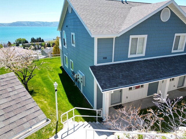 918 N Newberg Dr N Unit 4, Garden City, UT 84028 - view of side of property with a shingled roof and a water and mountain view