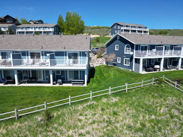 918 N Newberg Dr N Unit 4, Garden City, UT 84028 - rear view of property featuring a patio and roof with shingles