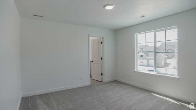 906 W Fallow Dr S Unit 213, Saratoga Springs, UT 84045 - carpeted spare room featuring baseboards