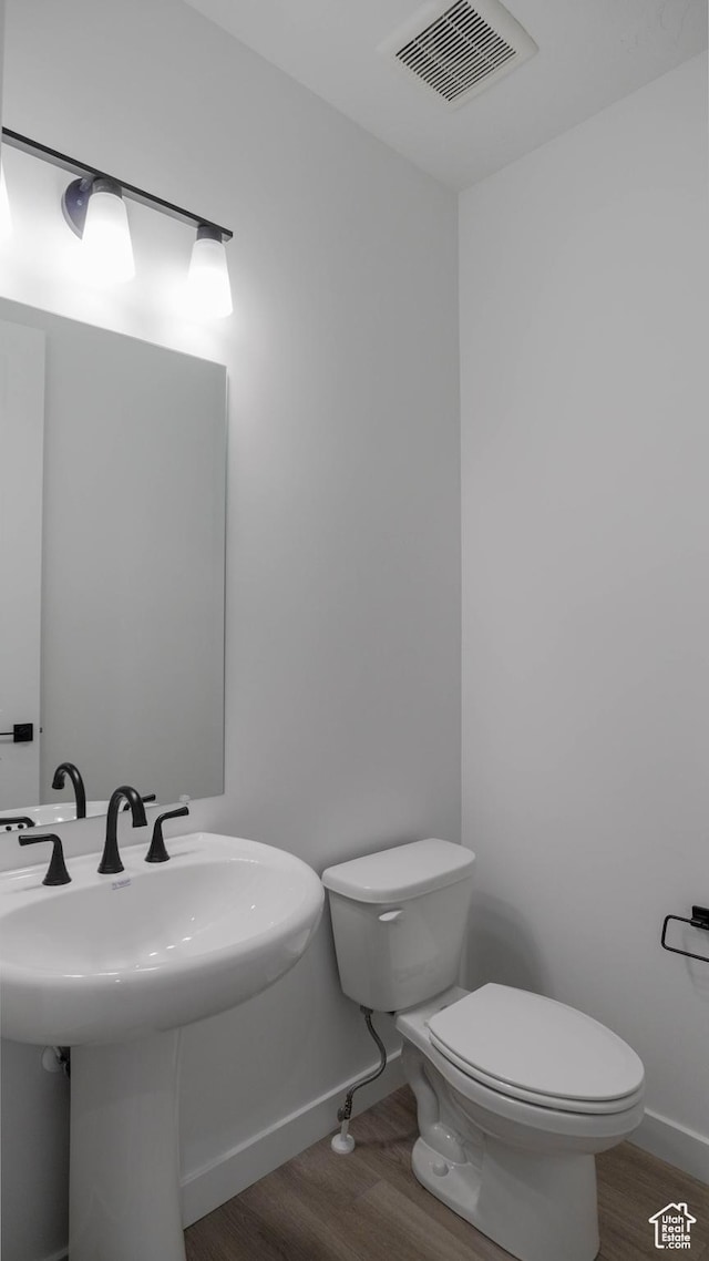 906 W Fallow Dr S Unit 213, Saratoga Springs, UT 84045 - bathroom featuring wood finished floors and toilet