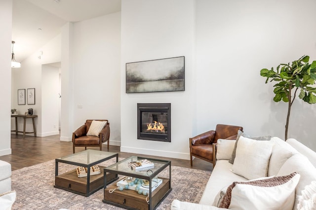 14943 S Auburn Sky Dr Unit 129, Draper, UT 84020 - living room featuring a glass covered fireplace, wood finished floors, and high vaulted ceiling