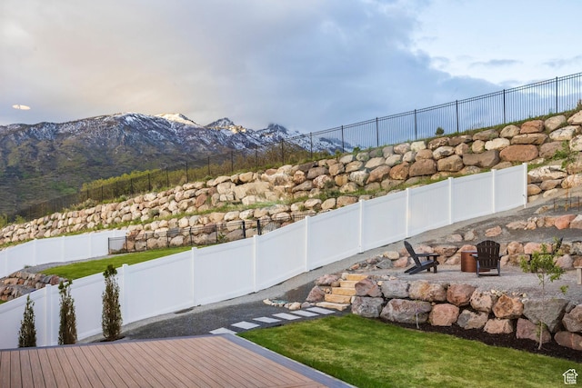 14943 S Auburn Sky Dr Unit 129, Draper, UT 84020 - fenced backyard featuring a mountain view and an outdoor fire pit