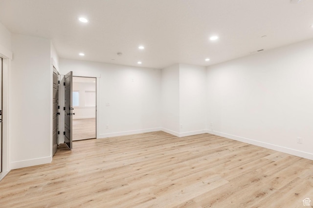 14943 S Auburn Sky Dr Unit 129, Draper, UT 84020 - spare room with recessed lighting and light wood-style flooring