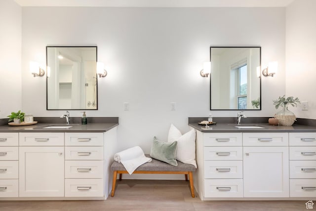 14943 S Auburn Sky Dr Unit 129, Draper, UT 84020 - full bathroom with two vanities and wood finished floors