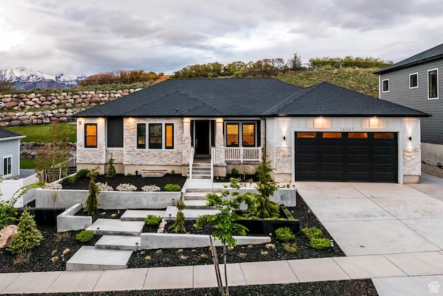 14943 S Auburn Sky Dr Unit 129, Draper, UT 84020 - view of front of house featuring a vegetable garden, stone siding, and an attached garage