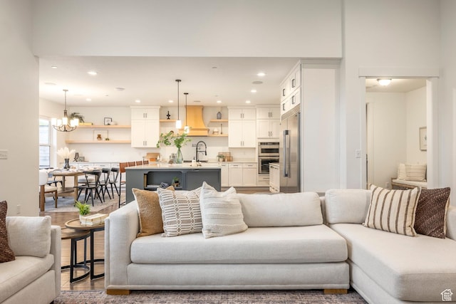 14943 S Auburn Sky Dr Unit 129, Draper, UT 84020 - living area with recessed lighting, a chandelier, and wood finished floors