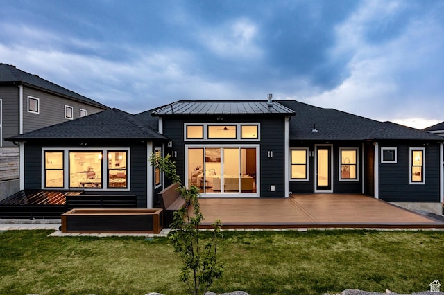 14943 S Auburn Sky Dr Unit 129, Draper, UT 84020 - back of property featuring a standing seam roof, a deck, and a yard