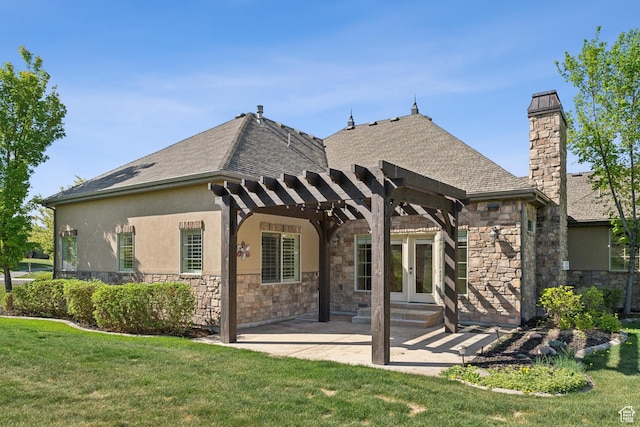 rear view of house with a pergola, stone siding, and a lawn