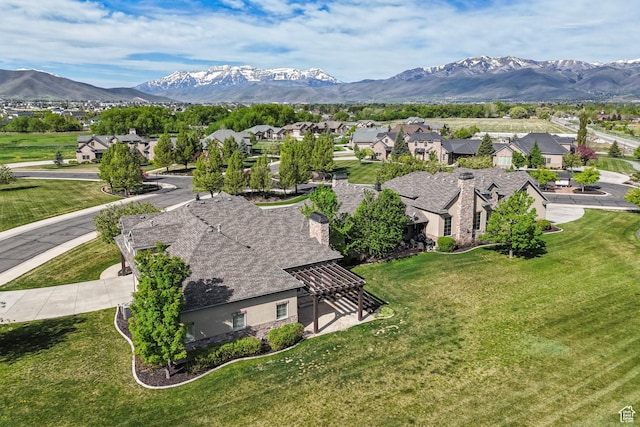 aerial view of residential area featuring mountains