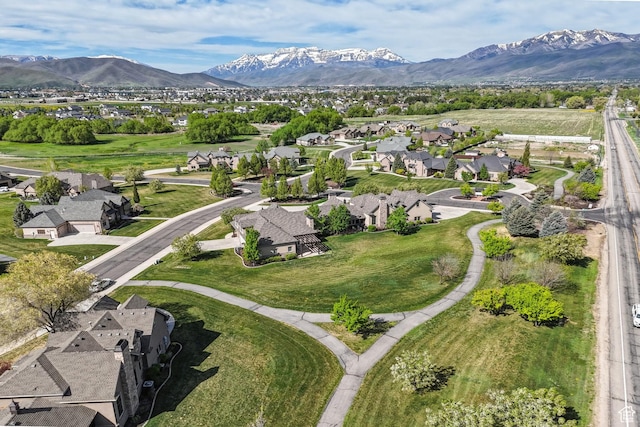 aerial view of property's location with nearby suburban area and mountains