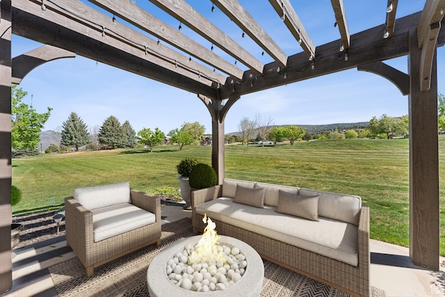 view of patio with an outdoor living space with a fire pit and a pergola