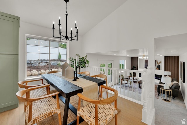 1128 N 850 E, Pleasant Grove, UT 84062 - dining area with a chandelier, light wood-style flooring, and high vaulted ceiling
