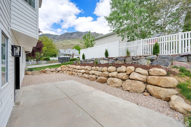 1128 N 850 E, Pleasant Grove, UT 84062 - view of patio / terrace with a mountain view and fence