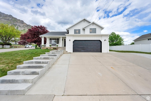 1128 N 850 E, Pleasant Grove, UT 84062 - view of front of home with concrete driveway, covered porch, and a garage