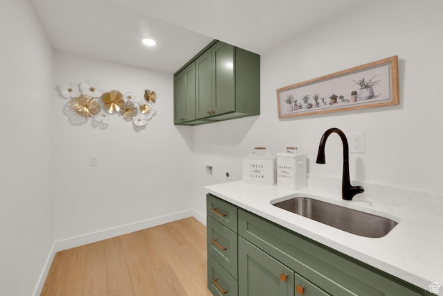 1128 N 850 E, Pleasant Grove, UT 84062 - laundry area featuring cabinet space, electric dryer hookup, light wood-style floors, baseboards, and recessed lighting