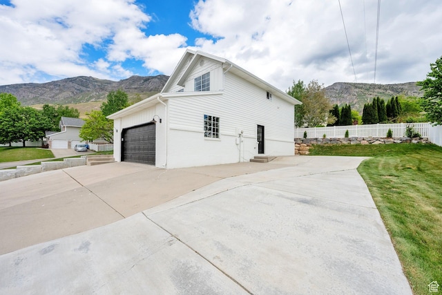 1128 N 850 E, Pleasant Grove, UT 84062 - view of property exterior with a mountain view, driveway, and an attached garage