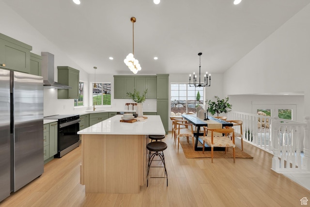 1128 N 850 E, Pleasant Grove, UT 84062 - kitchen featuring green cabinets, electric range oven, wall chimney exhaust hood, freestanding refrigerator, and a sink