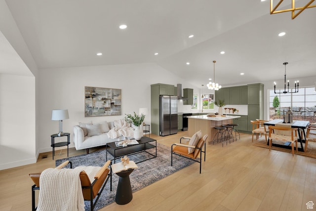 1128 N 850 E, Pleasant Grove, UT 84062 - living room featuring a chandelier, vaulted ceiling, light wood finished floors, recessed lighting, and baseboards