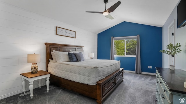 bedroom with lofted ceiling, dark carpet, ceiling fan, and baseboards