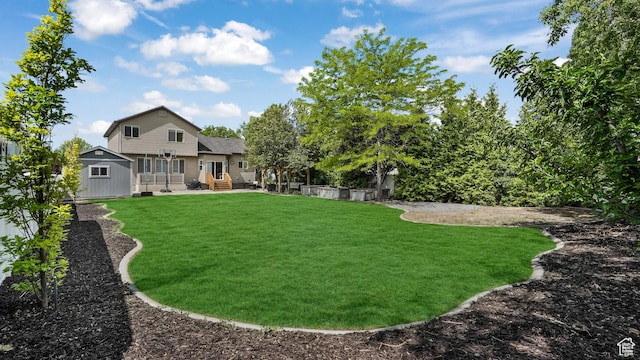 view of grassy yard featuring an outbuilding and a storage shed