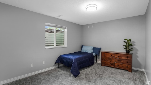 bedroom featuring carpet flooring and baseboards