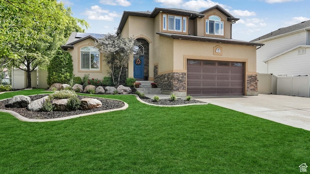 view of front of home featuring stucco siding, driveway, an attached garage, and stone siding