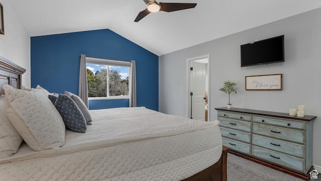 carpeted bedroom with lofted ceiling and a ceiling fan