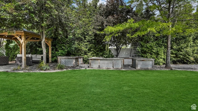view of green lawn featuring a gazebo and outdoor lounge area