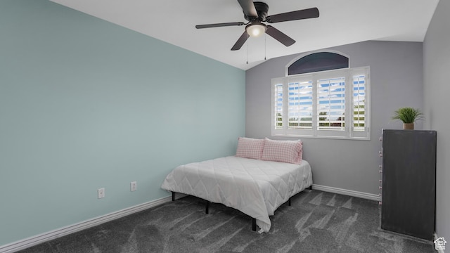 bedroom featuring carpet, baseboards, vaulted ceiling, and ceiling fan