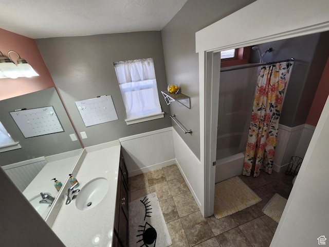 9362 N Sunnyvale Dr, Eagle Mountain, UT 84005 - bathroom featuring healthy amount of natural light, wainscoting, vanity, and shower / bath combo with shower curtain